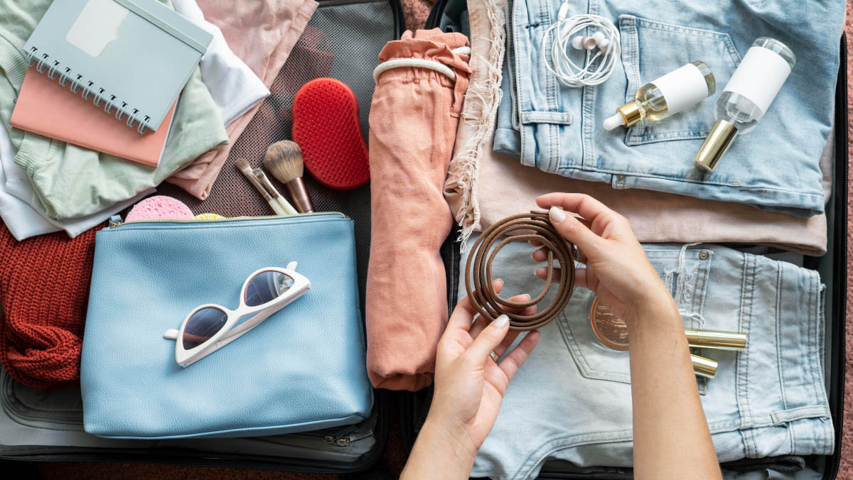 a person organising accessories for packing