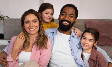 husband and wife with their two kids