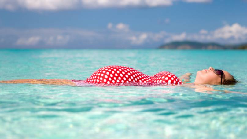 pregnant lady relaxing in the sea