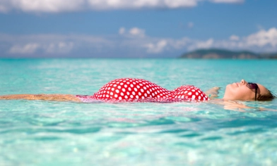 pregnant lady relaxing in the sea